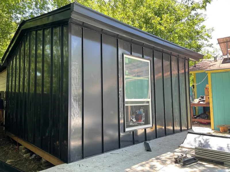 Black standing seam metal wall panels for Roof Inspection in River Ridge