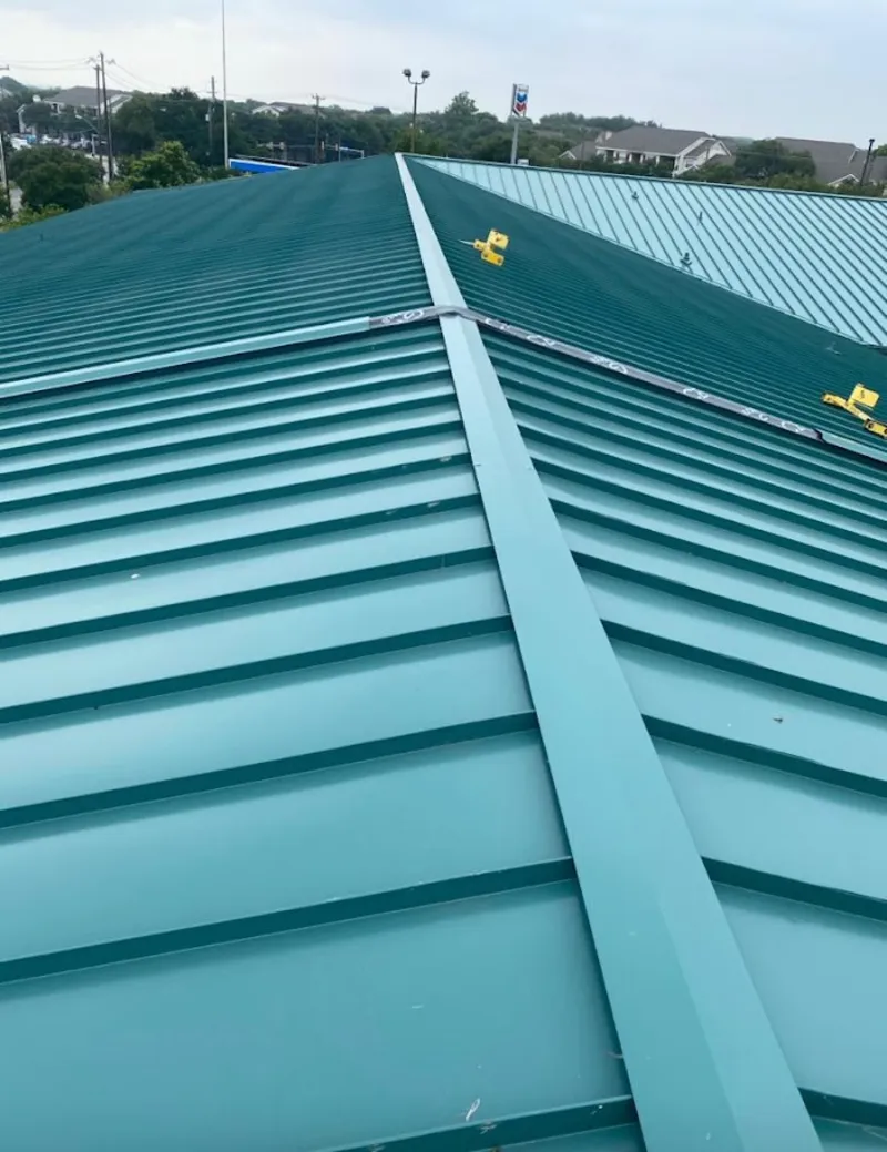 Green commercial metal roof ridge and valley for Metal Roof Repair in River Ridge